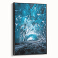 Framed canvas artwork depicting a stunning landscape with caves, featuring rich earth tones and intricate details, displayed in a black frame for a modern aesthetic.
