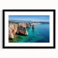 Framed landscape artwork depicting majestic cliffs with a black mat, showcasing natural beauty in a polished front view, perfect for home decor enhancement.