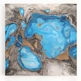 Colorful abstract splatter design on stretched canvas, featuring vibrant hues of blue, orange, and yellow, perfect for modern home decor or art enthusiasts.