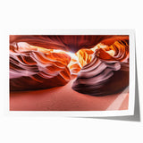 Desert landscape rolled print showcasing vibrant hues of orange and yellow under a bright blue sky, artistically captured on textured canvas for home decor.