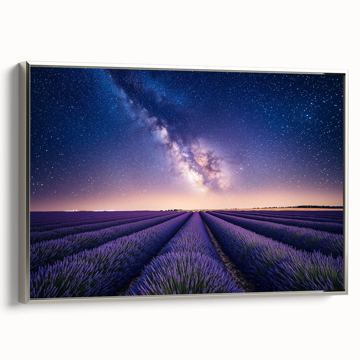 Framed canvas artwork depicting a serene landscape with rolling fields under a blue sky, showcasing a silver frame from a side view, perfect for home decor.