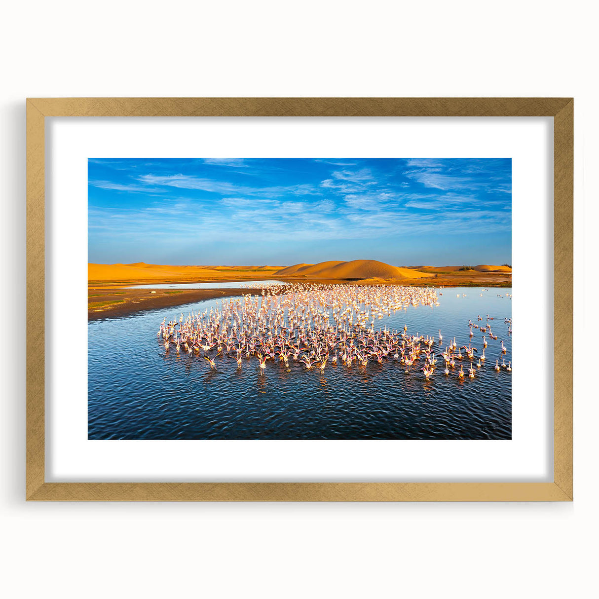 Textured abstract art print of African scenery in muted earth tones, framed with a gold mat, suitable for bedroom decor.