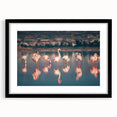 Extra large abstract art print of a colorful European scenery on textured canvas, framed in black.