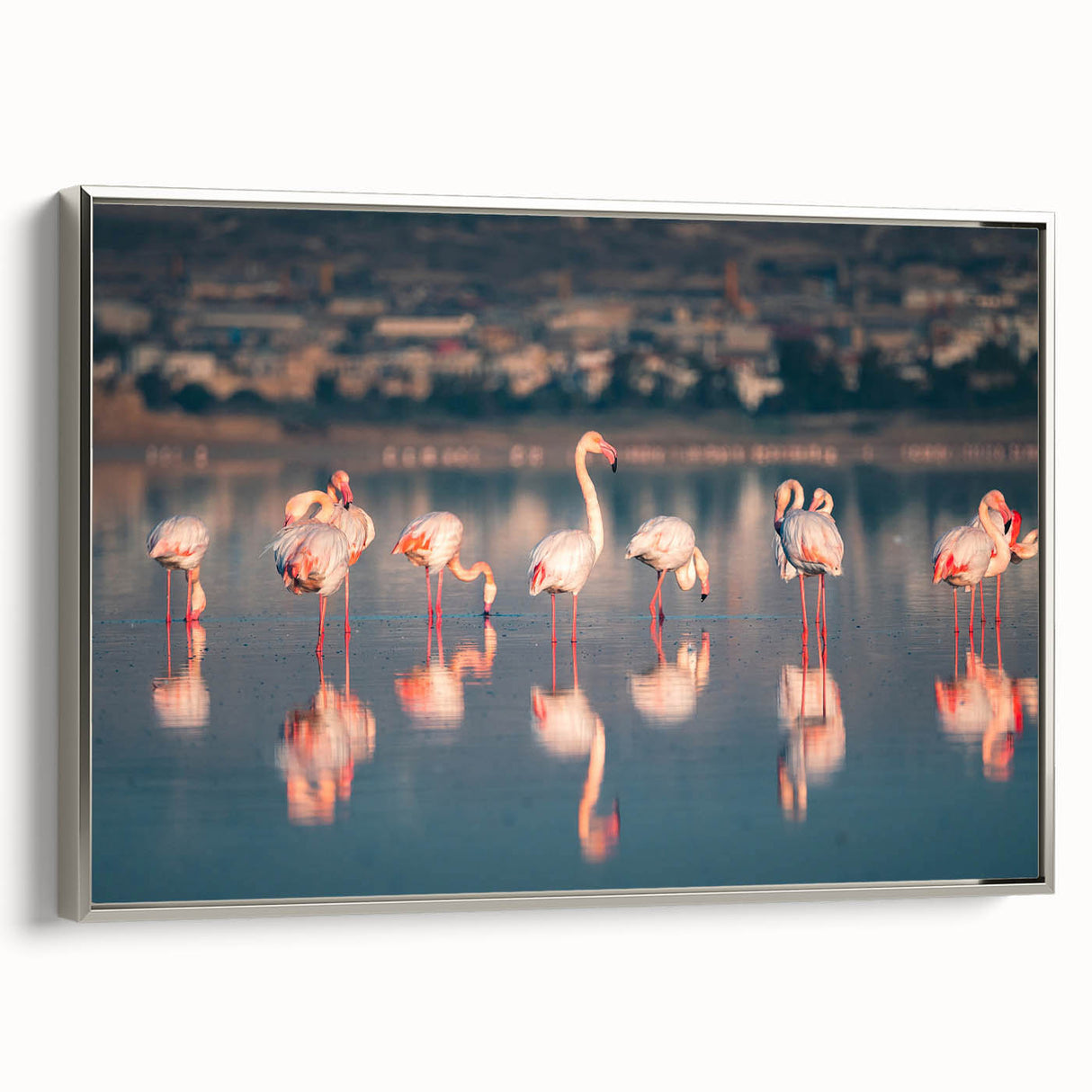 Framed canvas depicting a European landscape with vibrant green and blue tones, ideal for living room decor.