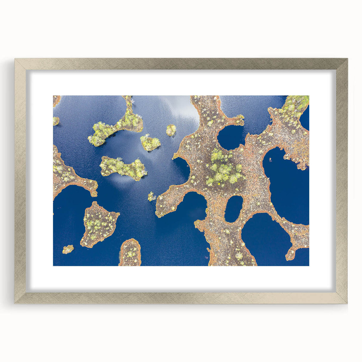 Extra large abstract art print of a European landscape in muted earth tones on a textured canvas, framed in silver.