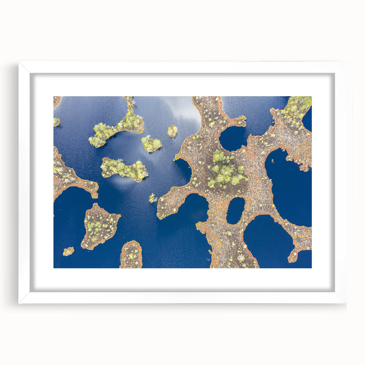 Textured abstract art print of a European landscape in muted earth tones, framed with a white mat.