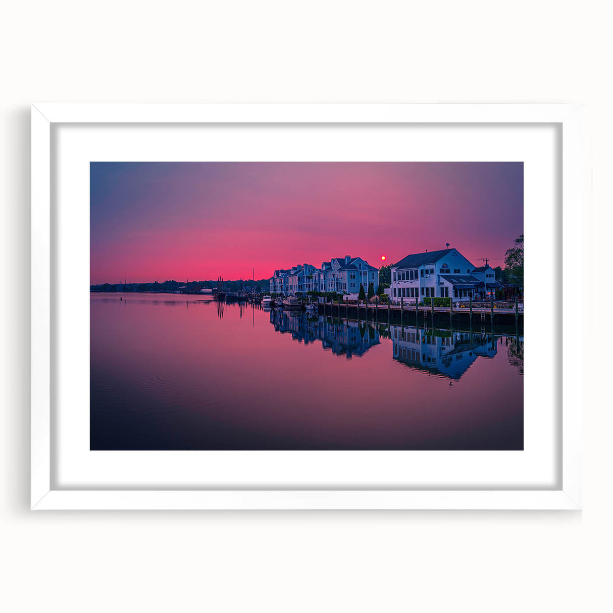 Abstract art print of Connecticut scenery in muted green and blue tones, framed with a white mat.