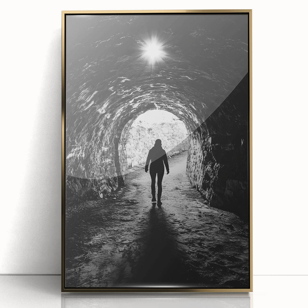 Framed acrylic artwork showcasing a stunning landscape with caves, highlighted by a shimmering gold border, perfect for modern home decor. This captivating piece adds elegance and depth to any living space.