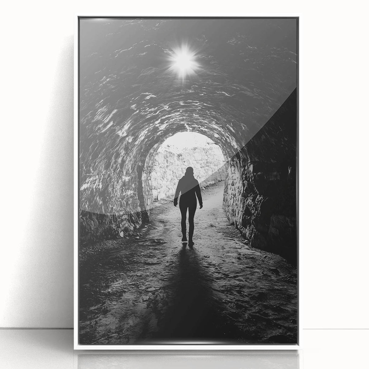 Framed acrylic artwork showcasing a stunning landscape with intricate cave formations, presented in a sleek white frame, perfect for modern home decor.