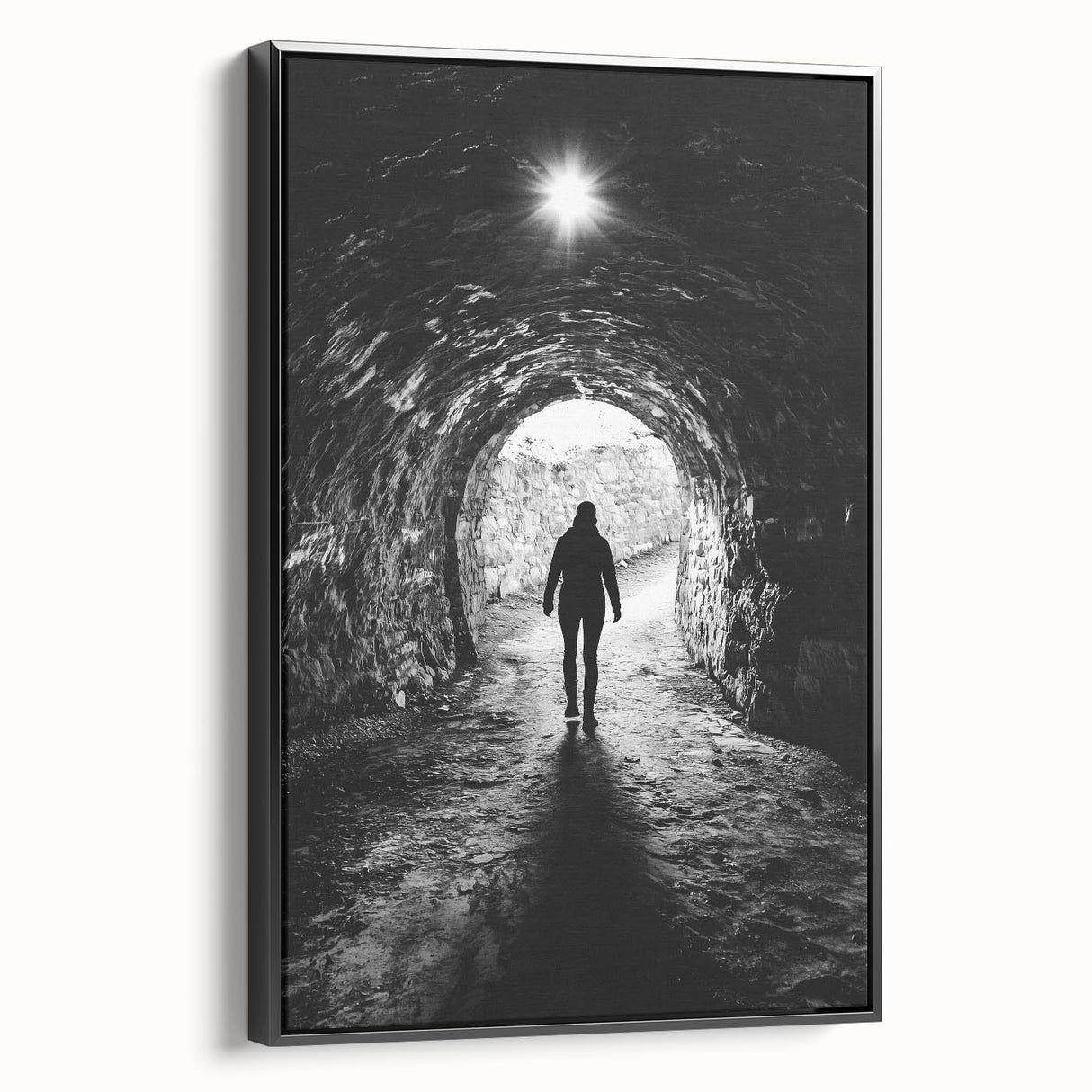Framed canvas artwork showcasing a dramatic cave landscape in earthy tones, viewed from the side against a black background, perfect for modern home decor.