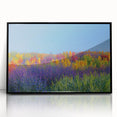 Framed acrylic artwork depicting a vibrant landscape with fields in various shades of green and gold, featuring a sleek black frame, ideal for home decor.