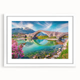 Textured art depicting an abstract European scenery in muted earth tones on a framed white mat, ideal for bedroom art.