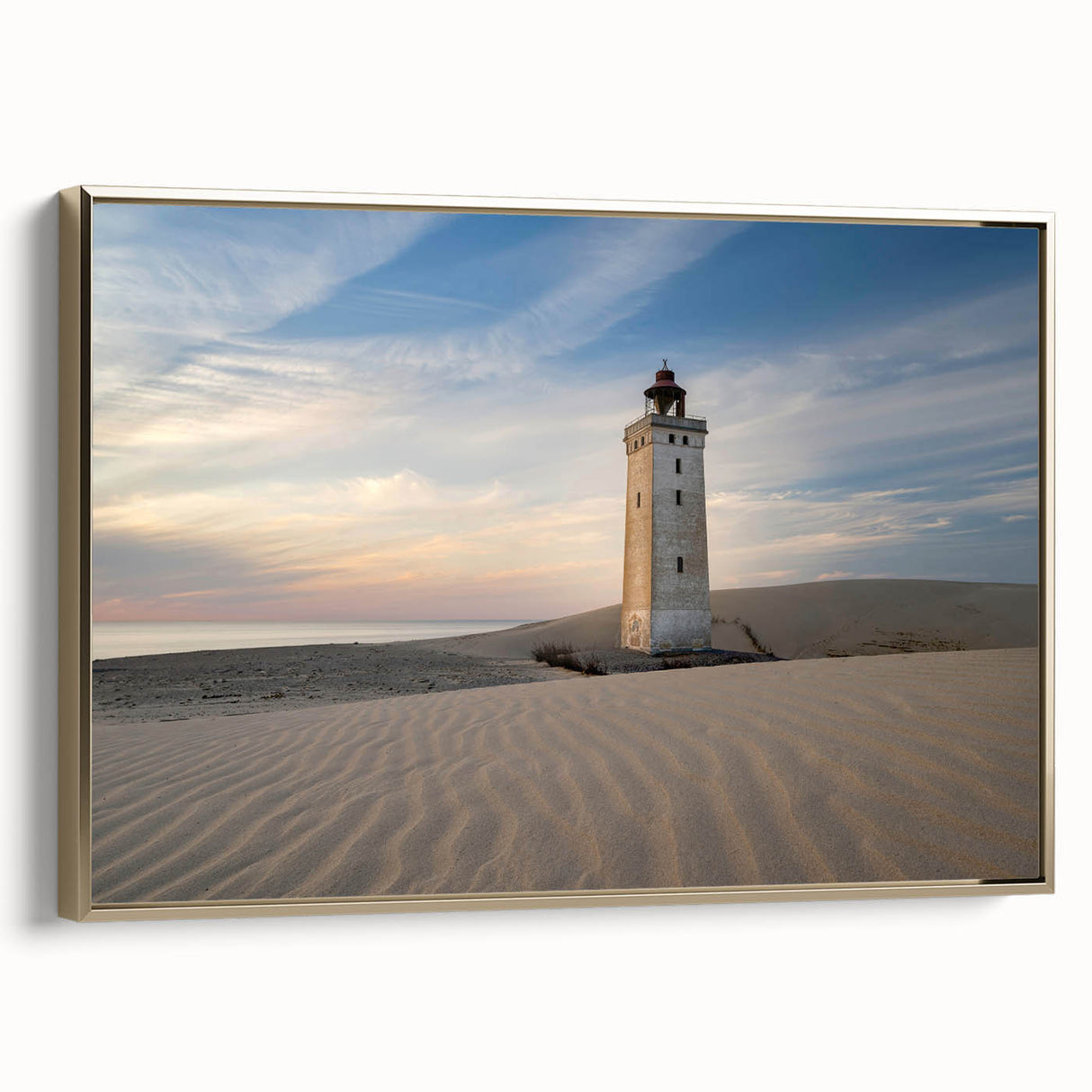 Framed canvas featuring a vintage-style landscape painting of a European scene in muted gold and black tones.