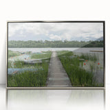Large art print of a European Estonian scenery in muted green and blue tones on a silver-framed acrylic.
