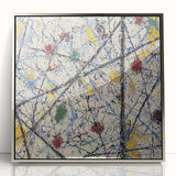 Framed abstract acrylic artwork featuring colorful splatters on a silver background, showcasing a modern design ideal for contemporary home decor.