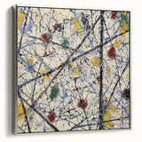 Abstract splatter artwork displayed in a sleek silver frame, showcasing vibrant colors and dynamic patterns, perfect for modern home decor.