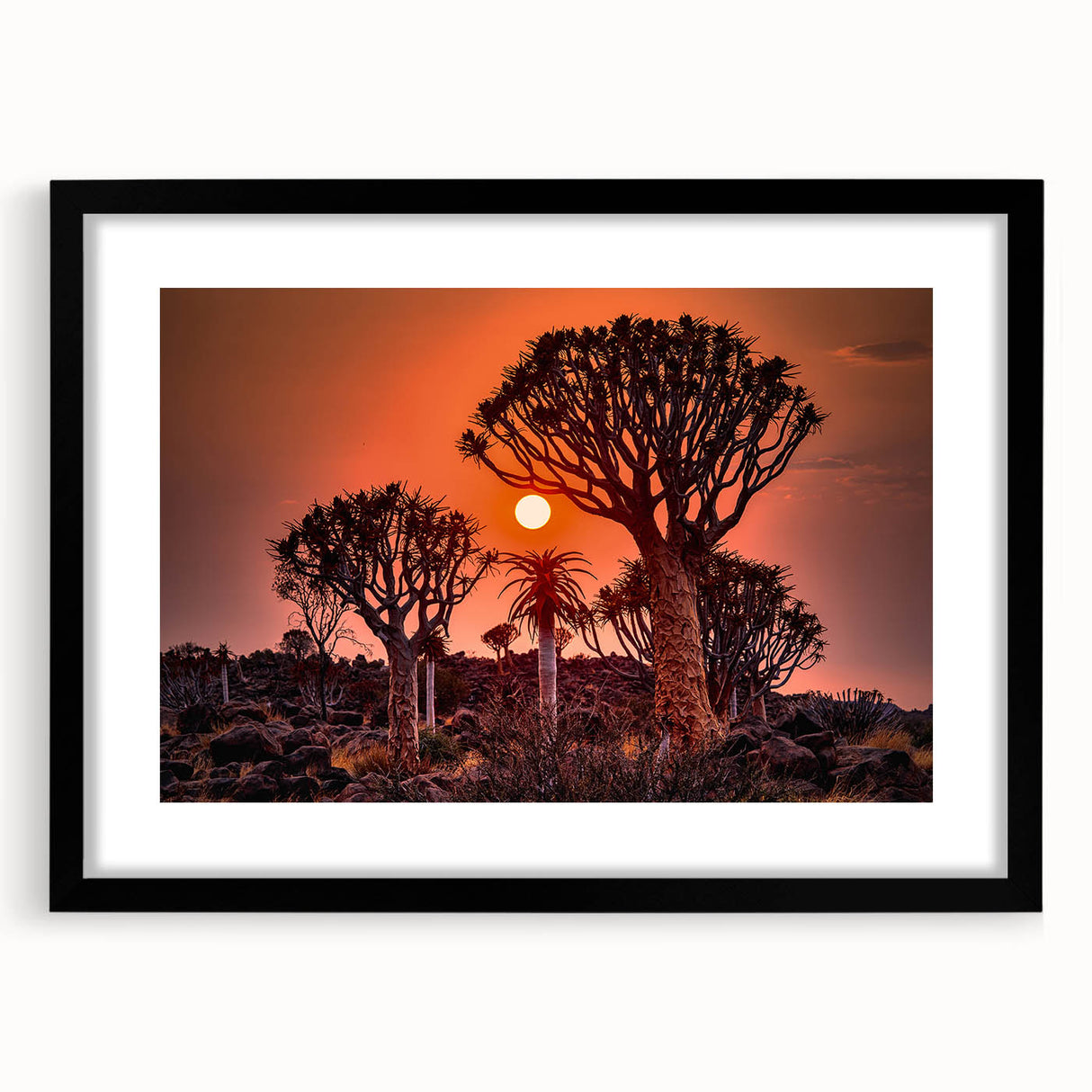 Extra large abstract art print of a colorful, textured African landscape on a framed black mat, ideal for living room decor.