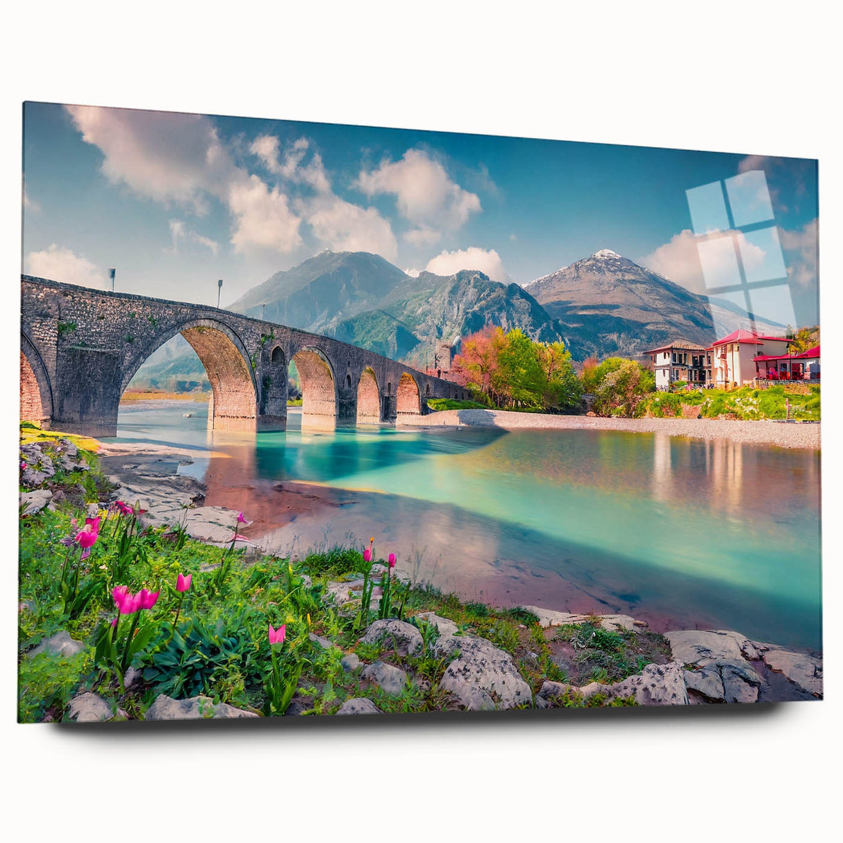 Large abstract wall art of a European scenery in vibrant blues and greens on acrylic glass.