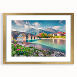 Textured abstract art print depicting a European scenery in muted earth tones, framed in gold, ideal for bedroom art.