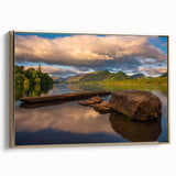 Framed canvas featuring a vintage-style landscape painting of Cumbria, England, in muted earth tones.