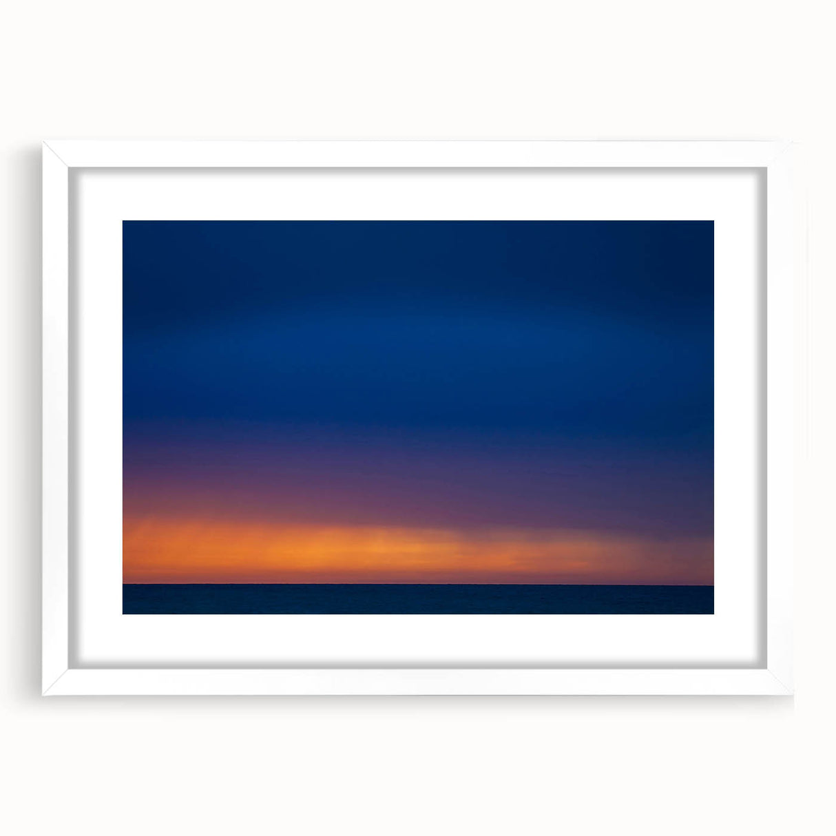 Abstract art print of Yucatán scenery in muted earth tones, framed with a white mat.