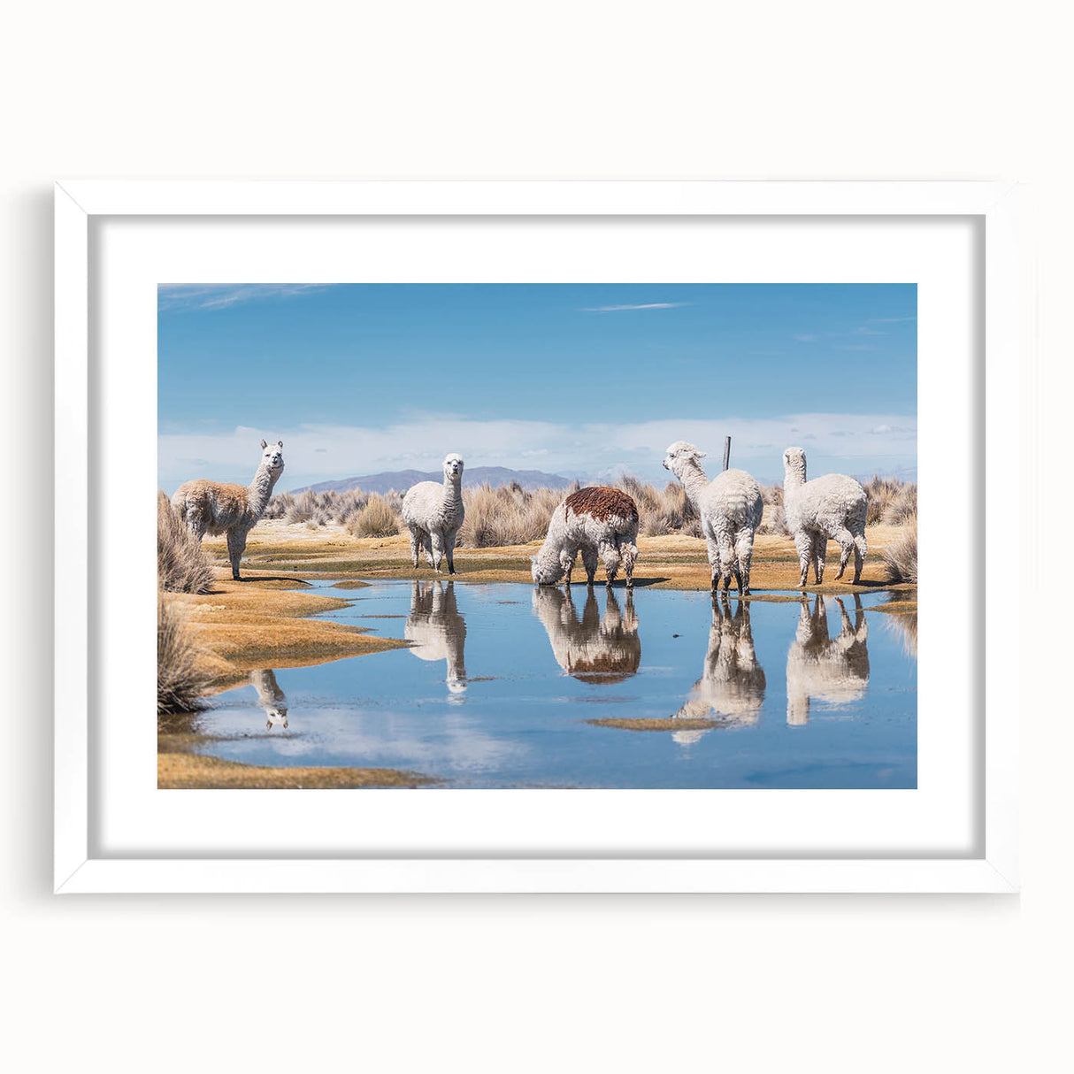 Abstract art print of South American scenery in muted earth tones, framed with a white mat.