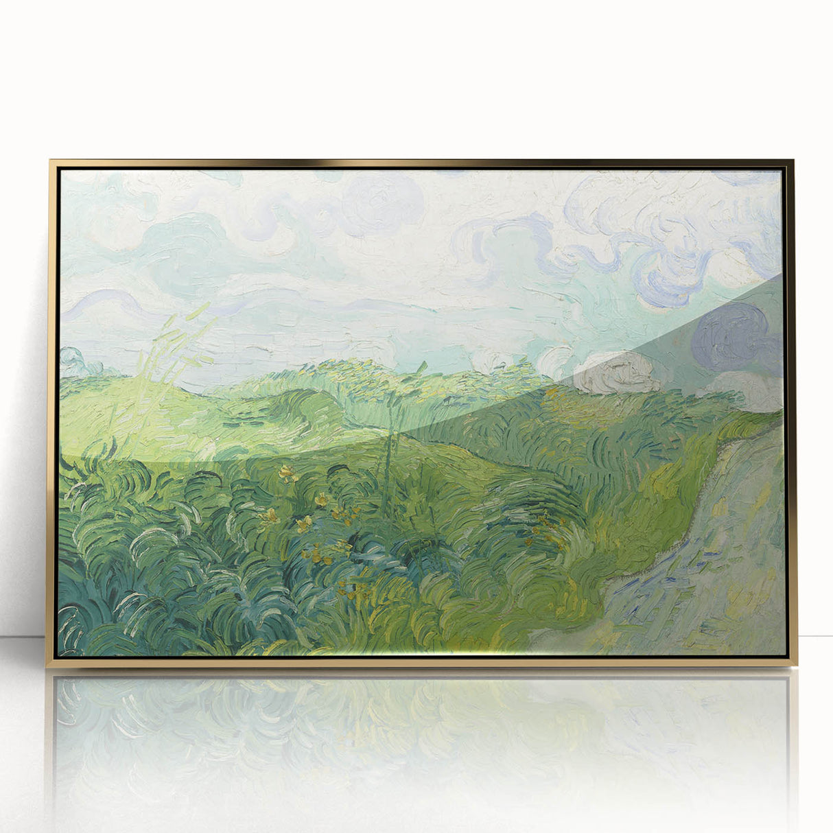Art deco poster of a stylized landscape in gold and blue tones, acrylic print framed in gold.