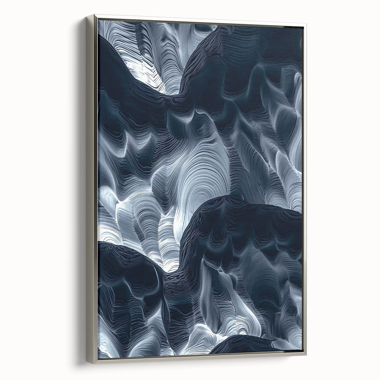 Framed canvas artwork showcasing a stunning landscape of caves, featuring silver edges, ideal for enhancing home decor with a modern touch.