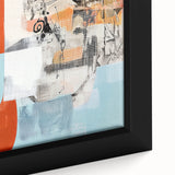 Close-up of a framed abstract canvas artwork showcasing vibrant splatter designs in blue, yellow, and red, perfect for modern home decor and artistic interiors.