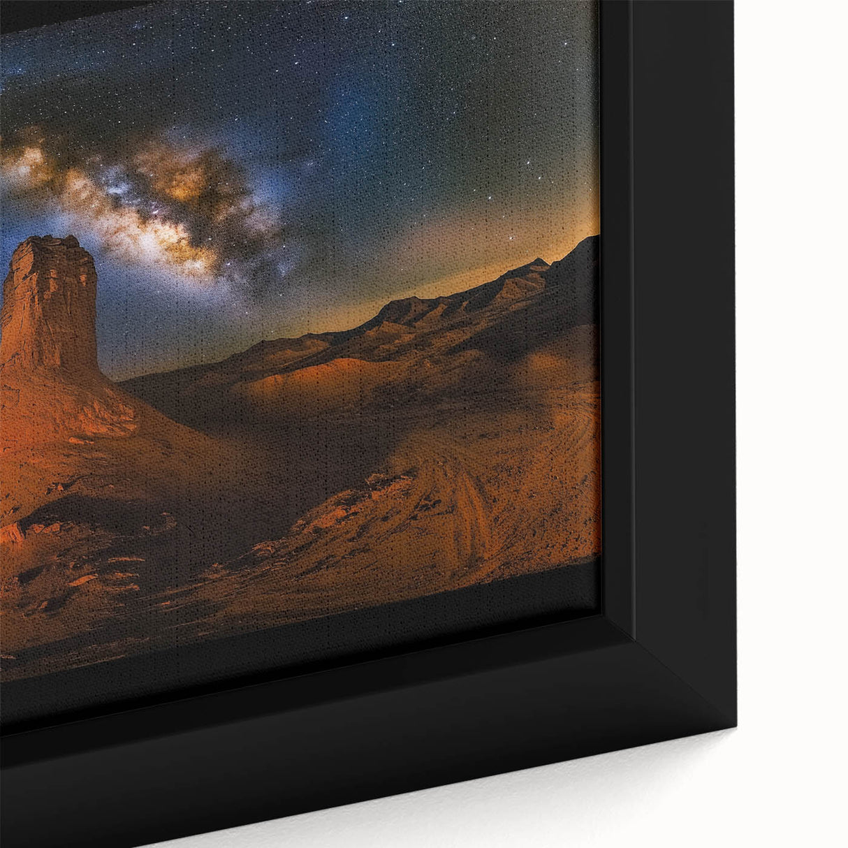 Close-up of a framed canvas depicting a vibrant desert landscape with rich colors and intricate details, showcasing the beauty of arid scenery in a modern design.