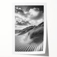 Desert landscape print showcasing golden sand dunes under a clear blue sky, rolled and packaged in a protective cardboard tube for safe shipping.