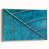 Framed canvas featuring close-up of leaves in muted green and silver, ideal for enhancing a minimalist decor.