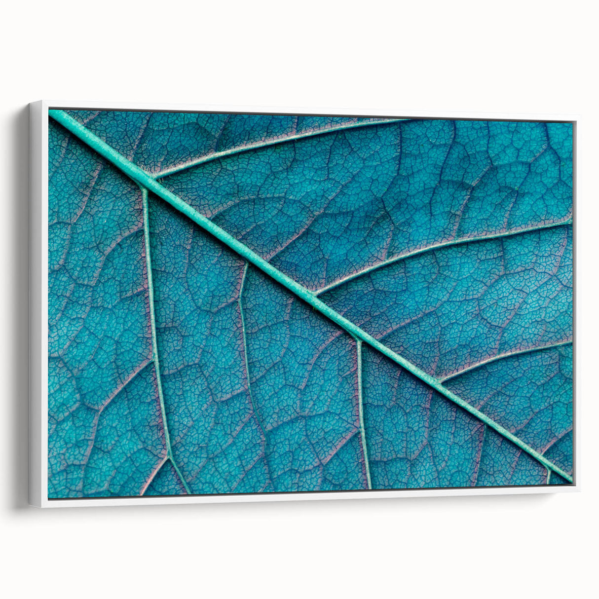 Vintage poster art of close-up leaves on a framed canvas, featuring vibrant green and yellow tones.
