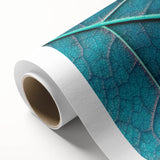 Art deco poster of close-up leaves in soft green hues on rolled canvas, ideal for nursery wall art.