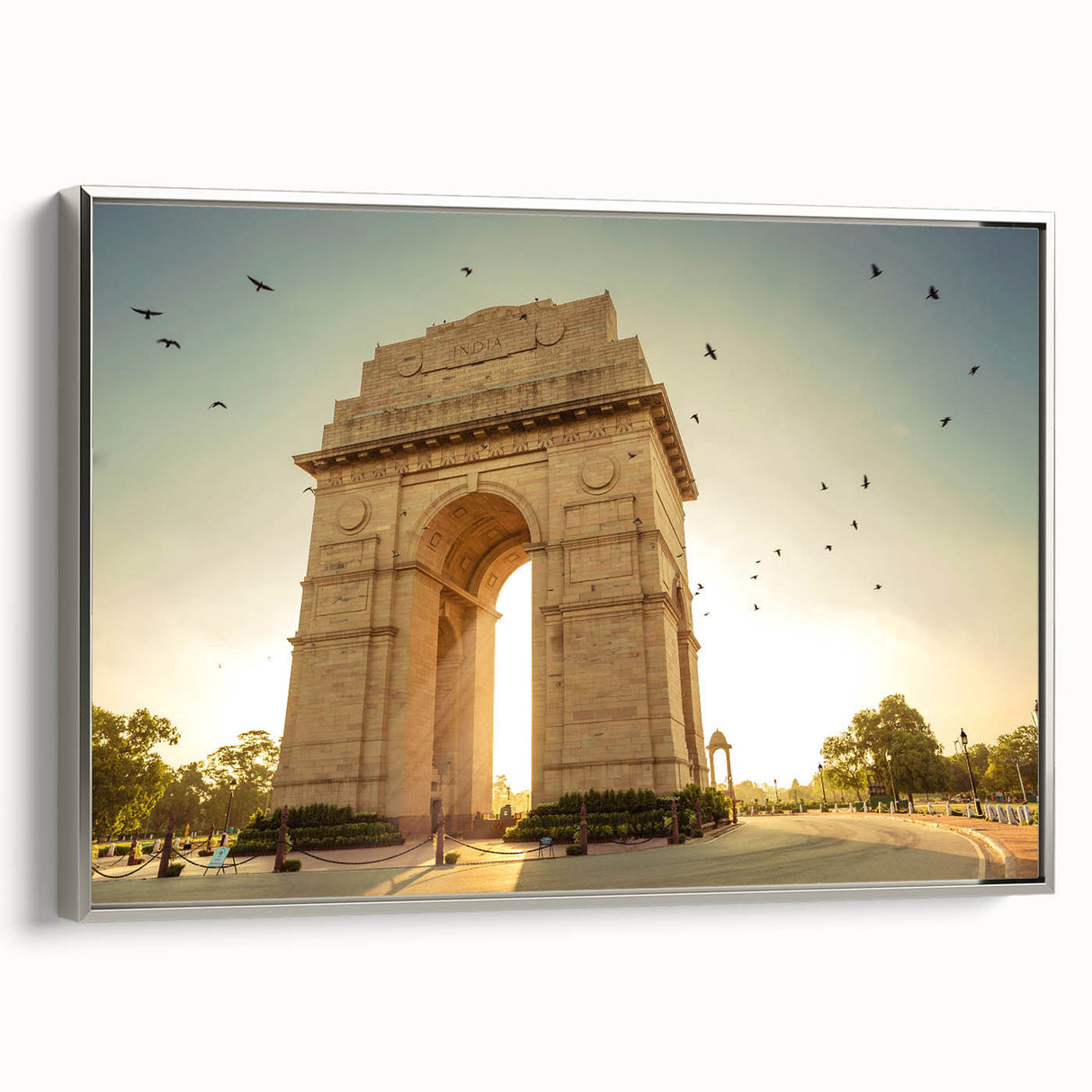 Framed canvas landscape art painting depicting a vintage-style Indian scenery in vibrant colors and black tones.