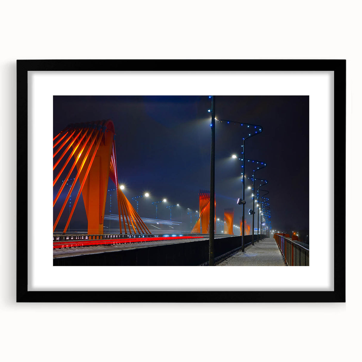 Extra large abstract art print of a vibrant, colorful European scenery on textured canvas, framed in black.