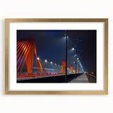 Abstract art print of a European landscape in muted gold and blue tones, framed with a gold mat.