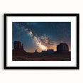 Framed landscape artwork showcasing dramatic cliffs in a black mat, ideal for home decor. The modern design complements various interior styles, adding sophistication.
