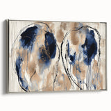 Framed canvas artwork showcasing vibrant abstract splatter designs in shades of blue and silver, adding a modern touch to home decor. Ideal for contemporary art lovers.