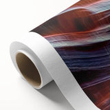 Vibrant landscape canvas print showcasing colorful canyons and rugged terrain, rolled for easy transport and perfect for home decor or art enthusiasts.