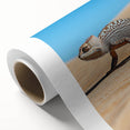 Desert landscape artwork on rolled canvas showcasing vibrant sandy hues and cacti, elegantly packaged in a protective cardboard tube for easy display.