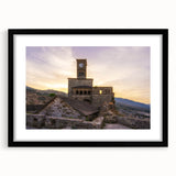 Extra large abstract art print of a colorful European scenery on textured canvas, framed in black.