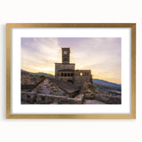 Abstract art print of a European scenery in muted earth tones, framed in gold, suitable for dining room decor.