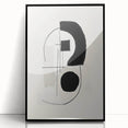 Framed abstract minimalist wall art featuring bold black lines and geometric shapes, elegantly displayed against a light background, perfect for modern decor.