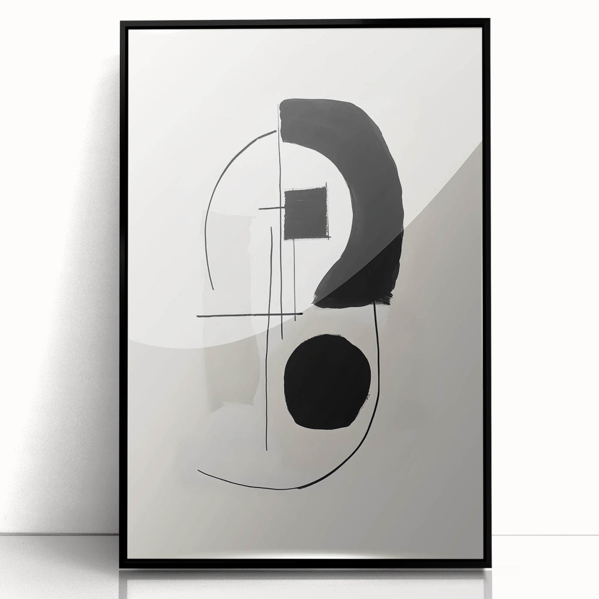 Framed abstract minimalist wall art featuring bold black lines and geometric shapes, elegantly displayed against a light background, perfect for modern decor.