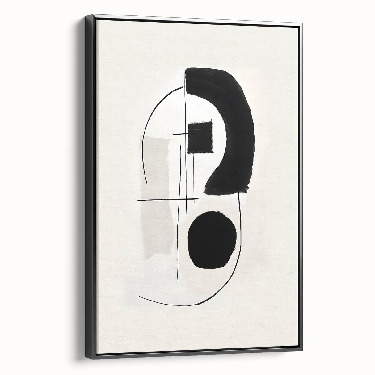 Framed minimalist wall art showcasing an abstract design with black tones, displayed from a side angle to highlight its sleek profile and elegant finish.