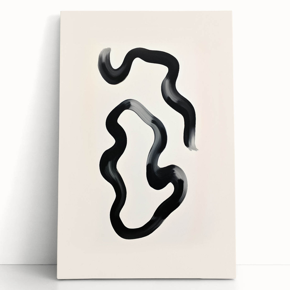 Abstract minimalist wall art on stretched canvas, showcasing a blend of soft beige and gray hues, leaning against a white wall, adding a modern touch to interior decor.