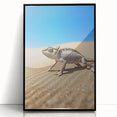 Framed acrylic artwork depicting a serene desert landscape, showcasing warm tones of orange and yellow against a black frame, ideal for modern home decor.