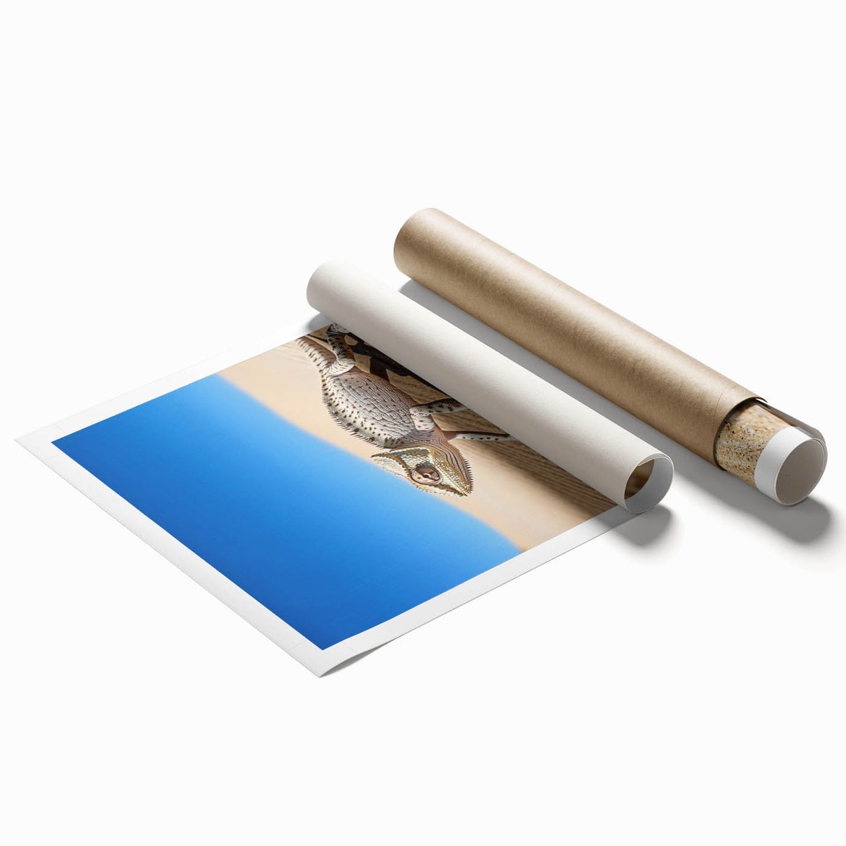 Desert landscape rolled canvas print showcasing warm hues of orange and yellow, depicting rolling sand dunes under a clear blue sky, elegantly packaged for delivery.