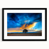 Black-framed landscape art print showcasing vibrant green fields under a clear blue sky, elegantly matted for added depth, ideal for modern home decor.